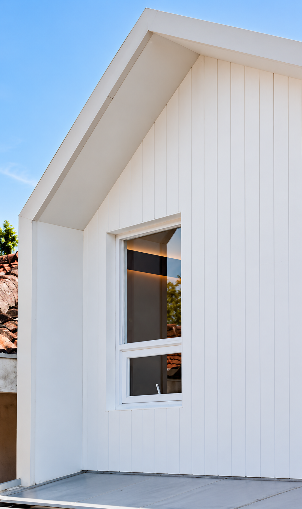 Modern Gabled Facade Under Blue Skies.png