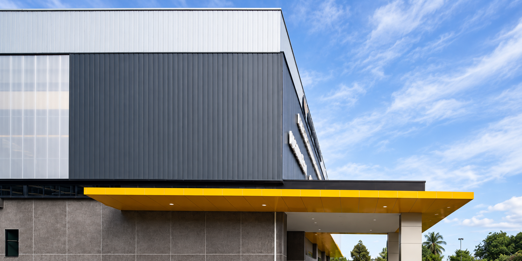 Modern Industrial Building with Yellow Canopy.png