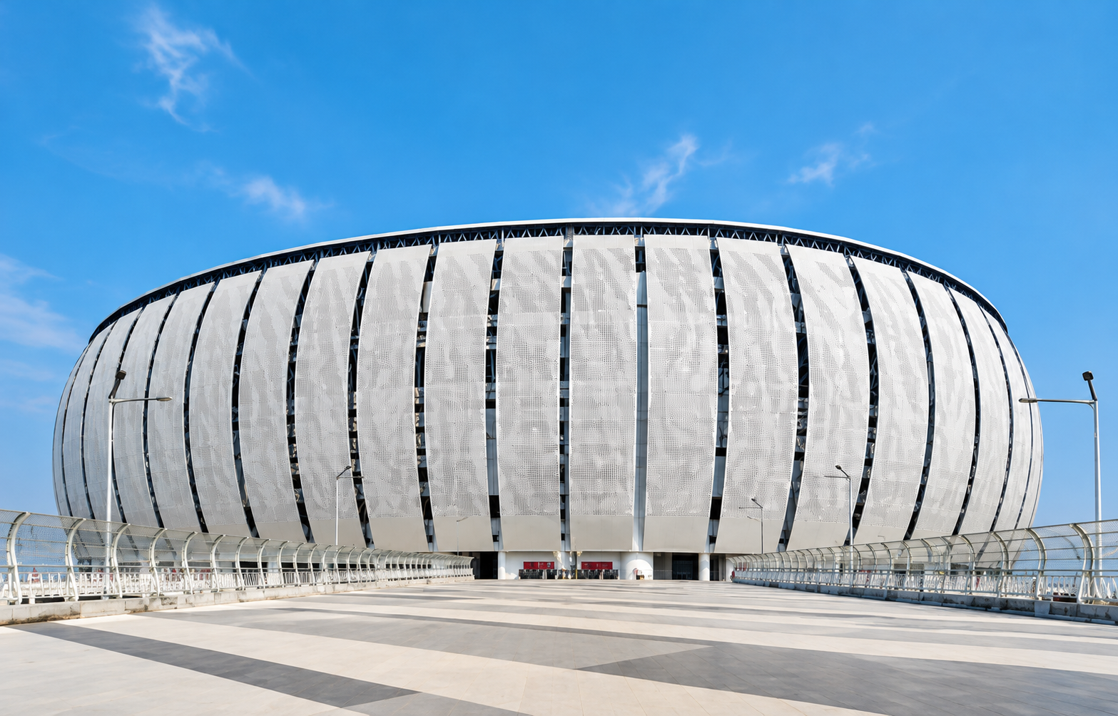 Futuristic Stadium Under Blue Skies.png