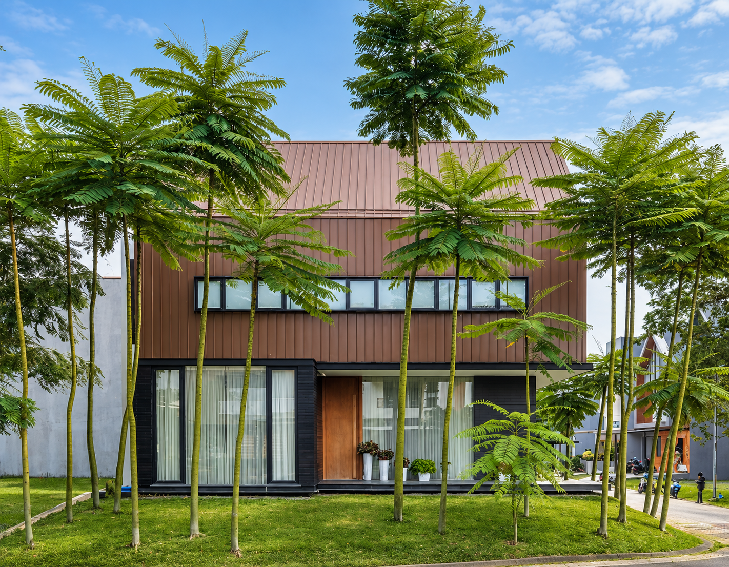 Modern Tropical Home Amidst Fern Trees.png